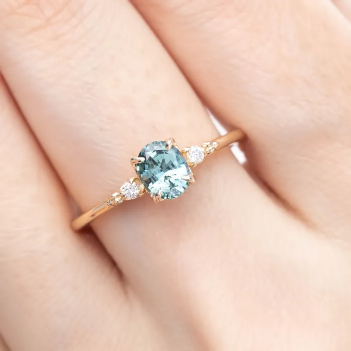 Envero Jewelry Rings Estel Ring 6x5mm 080ct Light Blue Green Oval Montana Sapphire 14K Yellow Gold