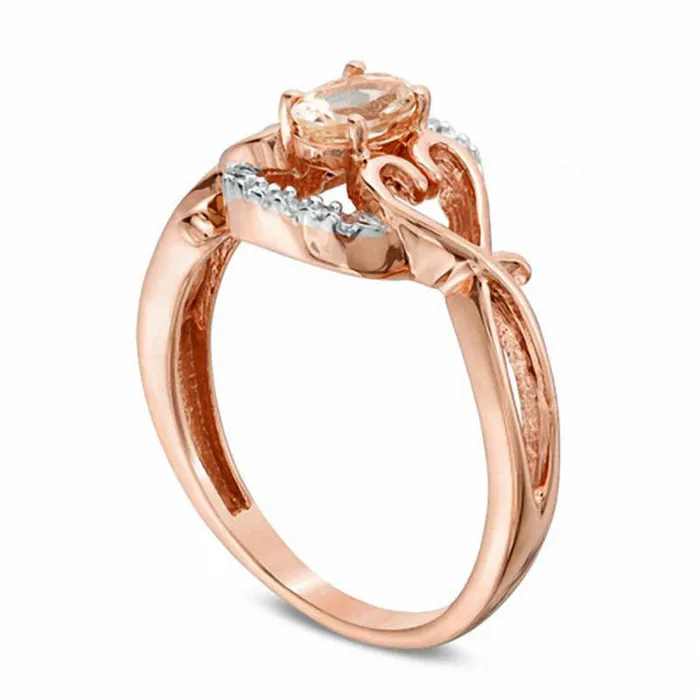 Rings Oval Morganite and Natural Diamond Accent Twisting Heart Sides Ring in Solid 10K Rose Gold Goldia Rings Oval Morganite and Natural Diamond Accent Twisting Heart Sides Ring in Solid 10K Rose Gold Goldia